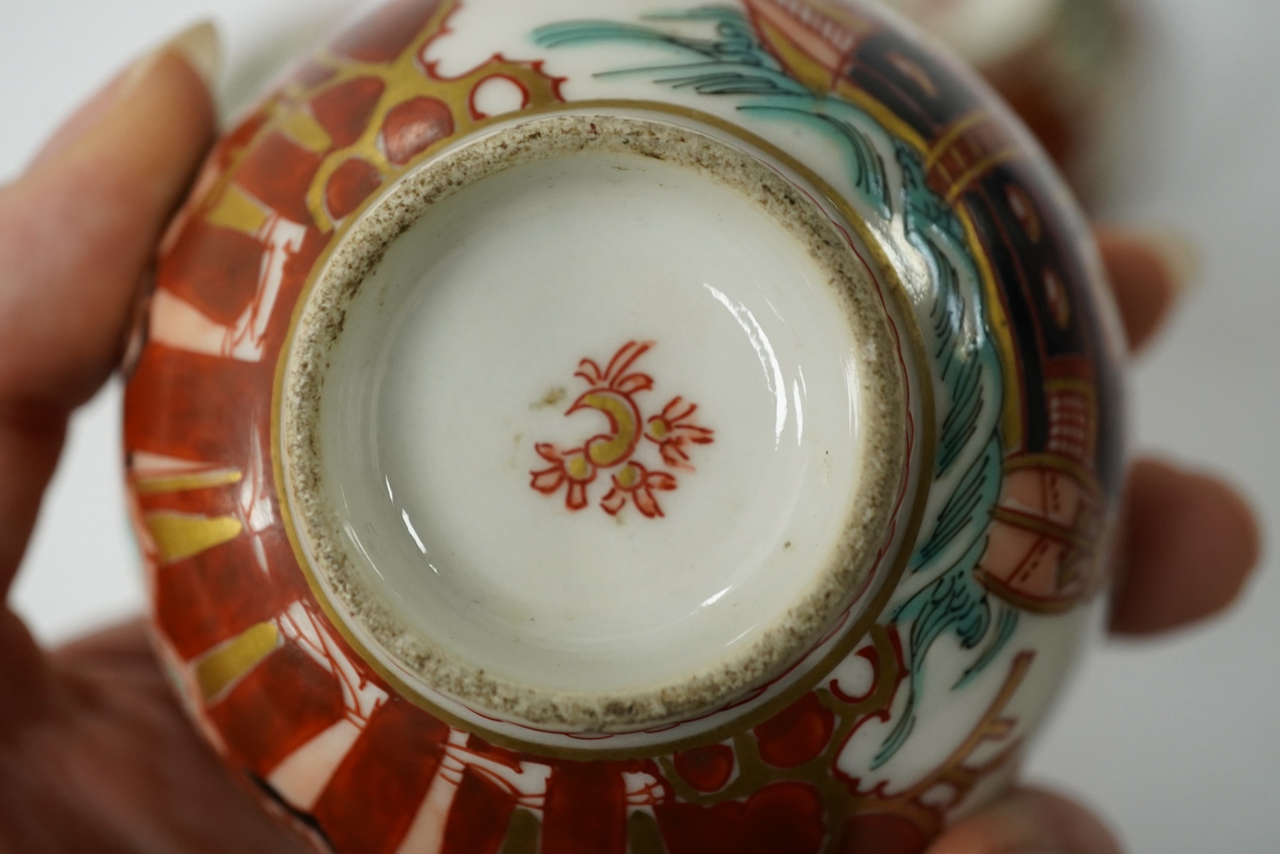 Three Imari ‘Black Ship’ teabowls, Meiji period, 8.5cm in diameter. Condition - good